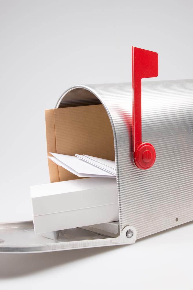 silver-metal-mailbox-open-with-mails-package (1)